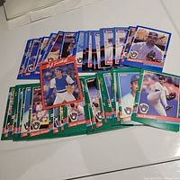 Photo of over 40 1991 Donruss Milwaukee Brewers baseball cards spread out showing various players with colored borders.