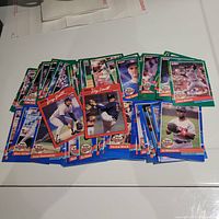 Photo showing a spread of approximately 50 1991 Donruss baseball cards featuring Minnesota Twins players with colorful borders and action/player shots.
