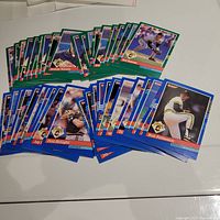 Photo showing over 40 1991 Donruss baseball cards featuring various Pittsburgh Pirates players spread out on a table.