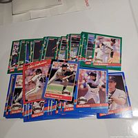 Photo of a pile of over 40 1991 Donruss San Francisco Giants baseball cards showing various players including Dave Righetti, Rob Thompson, Brett Butler, and Don Robinson.
