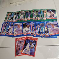 Over 40 Seattle Mariners baseball cards spread on a white surface, showing front images of players from the 1991 Donruss series.