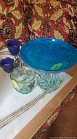 All five items shown together on table with patterned background