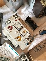 Klockner Moeller PKZ2-SP contactor and accessories on white fabric background with visible adjustment dials and connection terminals