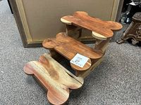 Side view of wooden dog steps showing three bone-shaped steps and their relative heights.