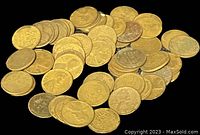 Close-up view of varied Wheat pennies scattered showing obverse and reverse details with noticeable wear.