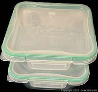 Stacked view of two Snapware glass storage containers with sealed lids.