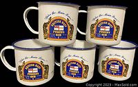 Five white enamel tin cups with blue rims and handles, front side showing British Navy Pusser's Rum logo with 'Splice the Main Brace!' text