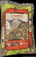 Front of sealed bag showing product name, branding, bird image, and product contents visually through packaging.