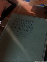 Green Standard Postage Stamp Catalogue book showing title and subtitle about Europe, Africa, Asia and Colonies