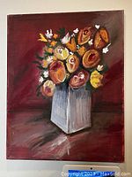 Photo of original floral chalk paint on canvas painting featuring roses in a vase with red background.