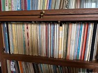 Shelf containing multiple softcover music books