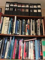 Photo showing shelves with a wide variety of automotive books and magazines, including many titles on classic, vintage, and sports cars.