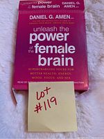 Front cover of the audiobook set 'Unleash the Power of the Female Brain' by Daniel G. Amen with a lot number sticker on it.
