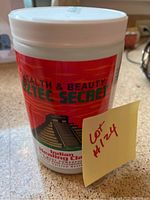 White container with red 'Health & Beauty Aztec Secret Indian Healing Clay' label, unopened.