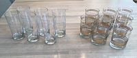 Front view of clear and frosted drinking glasses on table.