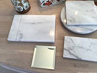 Photo of various marble cheese boards in different shapes and sizes.