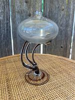 Clear art glass oil lamp with jellyfish style base, shown from the front