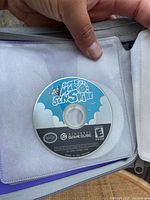 Photo of Super Mario Sunshine GameCube disc inside clear sleeve