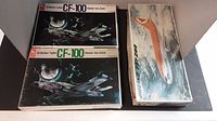 Photo of three airplane model kits: two CF-100 All-Weather Fighter kits and one Boeing 737-200, showing box art and condition.