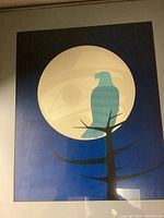 Framed art print showing blue eagle in front of a full moon on a blue background.