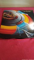 Front cover of the Electric Light Orchestra double album Out of the Blue showing colorful futuristic artwork with some surface wear and aging.