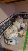 Full view of all items in the vintage kitchen set arranged on countertop