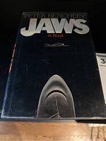 Front cover of book in mylar showing title and shark image