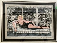 Full view of framed print laid flat showing mat, frame, image