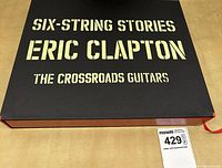 Top view of slipcase showing Six-String Stories Eric Clapton title in silver foil