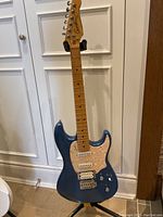 Full front view of the Godin Session electric guitar on Hercules stand