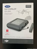 Front of sealed retail box showing LaCie DJI Copilot branding, 2000GB capacity and key feature callouts