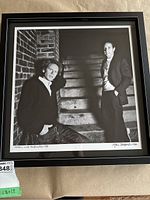 Full view of framed photograph showing Simon & Garfunkel on brick stairs