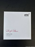 White outer box top with Montblanc logo and Marilyn Monroe signature