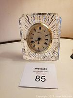 Front view of the French crystal desk clock showing clear starburst pattern and clock face with Roman numerals