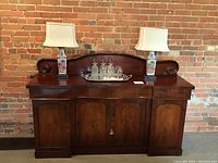 Full front view of sideboard with decorative items