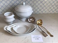 Overall lot: tureen with lid, two stemmed bowls, three dishes, two ladles