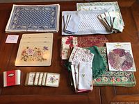 Overview of all placemats, napkins, and coasters laid out showing variety of patterns and colors