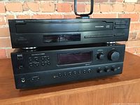 Stacked front view of Yamaha CD player above NAD receiver
