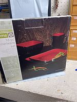 Box front showing black and red stoneware dishes and mugs by Global Home