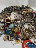 Full lot of assorted mixed-material jewelry, showing breadth of styles, colors, and shapes.