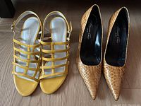 Photo shows two pairs of Kenneth Cole women's shoes on wooden floor: yellow strappy sandals and tan pointed toe pumps.