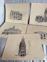 Five vintage Toronto landmark architectural prints arranged on a striped cloth backdrop. Prints include various historic buildings with clear details.