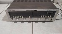Front view of Marantz Model 2240 receiver showing control knobs, tuning dial, and metal panel with wood grain top.