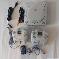 Full lot overview showing console, two controllers, VMU, power and AV cables