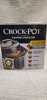 Front of Crock-Pot Express Crock XL box showing 7.5L capacity and features such as pressure cooking, slow cooking, sautéing, and steaming.