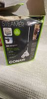 Photo of the product box for Conair steamer showing branding, features, and images.