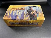 Closed Dragons Maze branded cardboard box showing Magic: The Gathering logo and artwork.