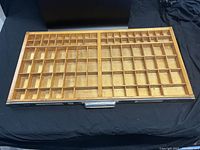 Full top view of the vintage wooden printers tray showing divided compartments and grid layout.