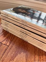 Stacked Vogue magazines showing spines with dates August 2003 to April 2015.