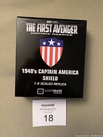 Box front with Marvel Studios logo, The First Avenger title, and labeling indicating 1940's Captain America shield 1:6 scaled replica, Lootcrate exclusive